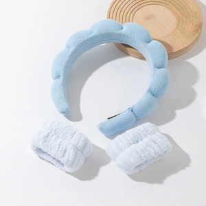 Three-piece sky blue cloud spa headband and matching wrist washbands set in soft coral fleece
