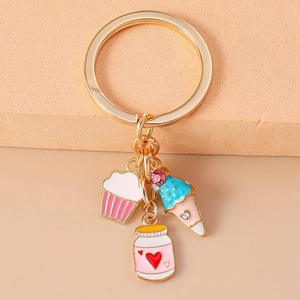 Kawaii dessert keychain with enamel cupcake and ice cream charms on gold metal ring