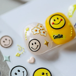 3D embossed nail art stickers with cute smile faces and daisies on vibrant yellow tips