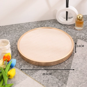 Detail of round beige velvet jewelry tray with champagne gold metal rim and dimensions