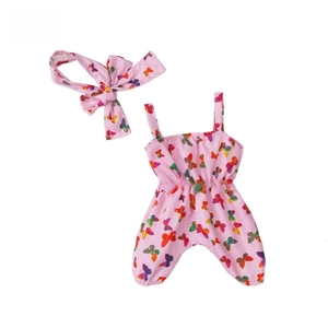 Detailed flat lay of pink butterfly print baby romper with matching bow headband set