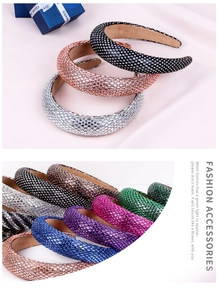 Detail of baroque padded headband with dense rhinestones in various vibrant colors