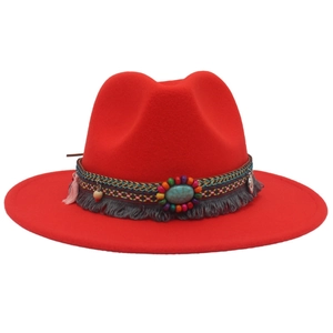 Red Western felt cowboy hat with ethnic bead decorations and turquoise stones
