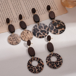 Retro geometric leopard print acrylic and wood drop earrings on white background