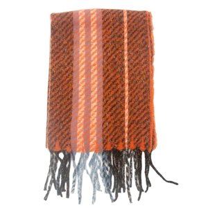 Close-up of winter striped scarf with orange and blue fringe and woven texture