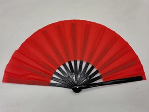 Close-up of red cloth surface and black bamboo frame of this Chinese Kung Fu folding fan