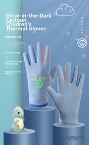 Close-up of waterproof fabric and warm fleece lining on blue dinosaur ski gloves