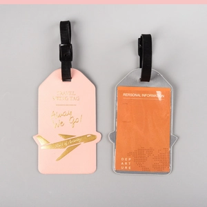 Set of two PU leather luggage tags in pink and silver with airplane motif for travel