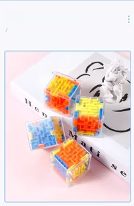 Set of four 3D puzzle cubes in various colors displayed on a pink artistic background