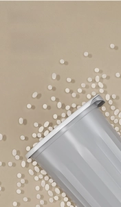 Detail of light grey PP waste bin featuring vertical ribbed texture and metallic rim