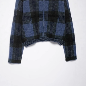 Blue and black buffalo plaid knitted jacket with metal zipper and ribbed hem details