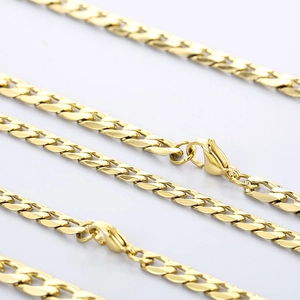 Detailed close-up of golden stainless steel curb chain necklace with secure lobster clasp