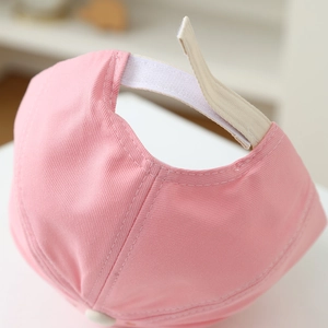 Pink cotton baseball cap for kids with adjustable velcro strap and soft twill texture