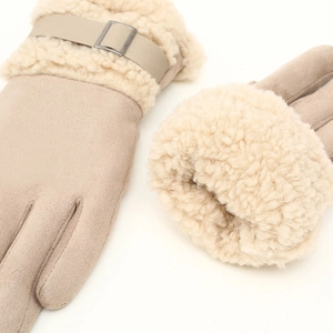 Close-up of beige suede thermal gloves with thick faux shearling lining and wrist buckle