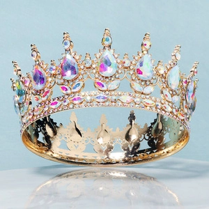 Close-up of golden bridal crown featuring iridescent AB rhinestones and teardrop crystals