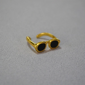 Unique brass gold plated open ring featuring a creative black sunglasses shape design