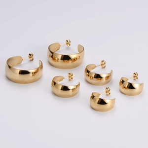 Three pairs of thick gold C-shaped stainless steel hoop earrings in various sizes