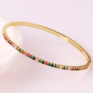 Elegant 18k gold plated oval bangle with colorful cubic zirconia stones in rainbow setting