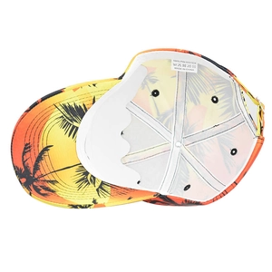 Detail of baseball cap interior showing tropical palm print and polyester material label