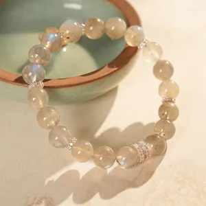 Natural moonstone beaded bracelet with blue sheen and sparkling silver spacer beads
