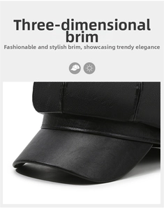 Detail shot of the sturdy brim and textured faux leather finish on a black baker boy cap