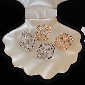 Gothic hollow cross stud earrings with sparkling zircon in gold and silver finishes