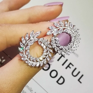 Detailed view of silver laurel wreath earrings featuring marquise-cut cubic zirconia stones