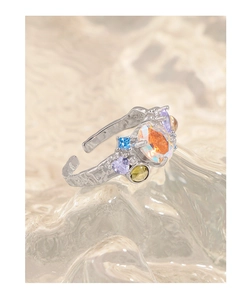 Macro shot of S925 sterling silver open ring with colorful zircon stones and textures