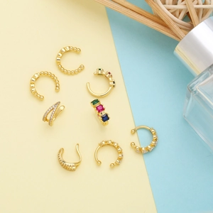 Detail view of 7-piece gold ear cuff set with colorful gemstones and rhinestones
