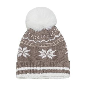 Detailed close-up of a brown and white winter knit hat with snowflake patterns and a pom-pom