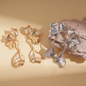 Elegant gold and silver metallic flower petal drop earrings with textured finish