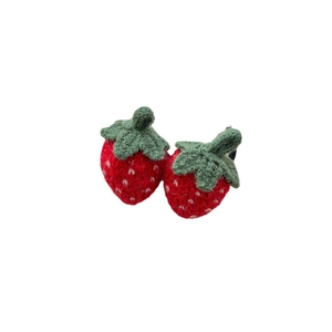 Handmade crochet strawberry hair clips with green leaves for girls on white background