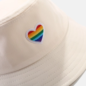 Detail of rainbow heart embroidery on high-quality beige cotton twill bucket hat