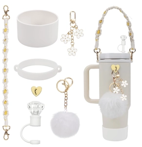 Detail of cute accessory set with straw cover and mini bag on a Stanley tumbler
