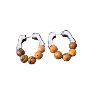 Vintage silver needle earrings featuring brown stone beads in a sleek circular design