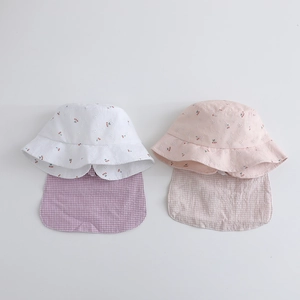 Detail of kids sun hats with cherry embroidery and plaid neck protection flap