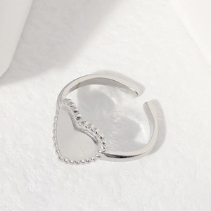 Polished silver heart-shaped adjustable stainless steel ring with beaded edge detail