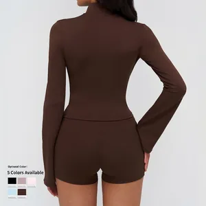 Deep brown yoga jacket with stand collar and zipper, paired with slim athletic shorts
