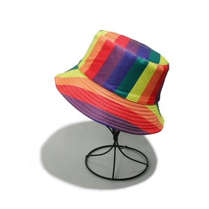 Close-up of vibrant rainbow striped bucket hat showing detailed stitching and satin fabric