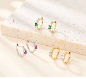 Detailed close-up showing S925 sterling silver hallmark on these zircon hoop earrings