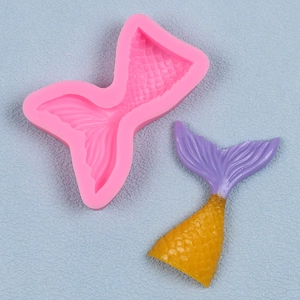 Detail of pink silicone mermaid tail mold with intricate scales and fin textures