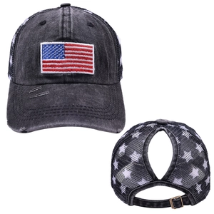 Detail of high ponytail hole on washed denim American flag mesh back baseball cap