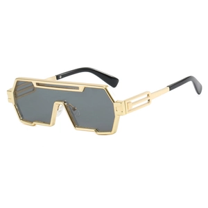 Modern punk style oversized gold sunglasses with geometric frames and dark lenses