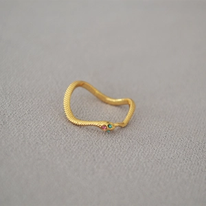 Elegant gold snake wrap ring with textured scales and sparkling colorful gemstone eyes