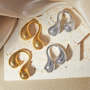 Minimalist gold and silver double teardrop open rings with smooth and textured finishes