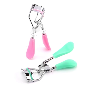 Pink and green manual eyelash curlers with non-slip plastic handles and steel frame