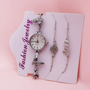 Detailed view of silver women's quartz watch set with butterfly and star bracelets