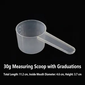 Macro detail of 30g plastic measuring spoon with clear internal scale lines and long handle