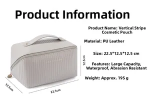 Detailed view of grey vertical stripe pillow makeup bag with dimensions 22.5x12.5x12.5cm