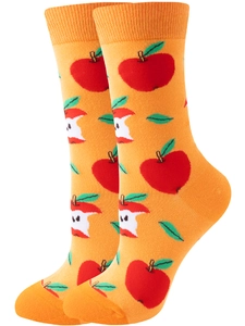 Close-up of vibrant orange knitted socks featuring red apple and core jacquard patterns
